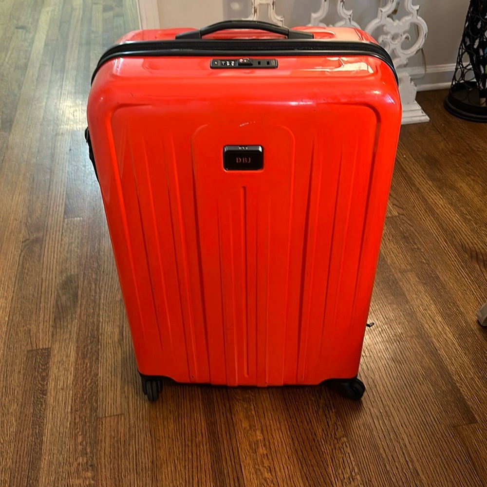 Tumi large checked suitcase red